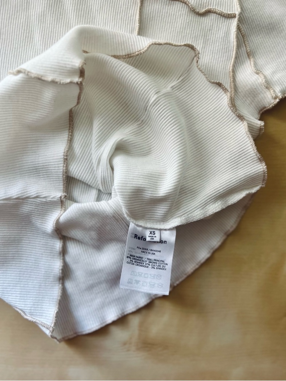 Reformation Cream Ribbed Lettuce-Edge Short Sleeve Tee with Exposed Seams - Picture 5 of 6